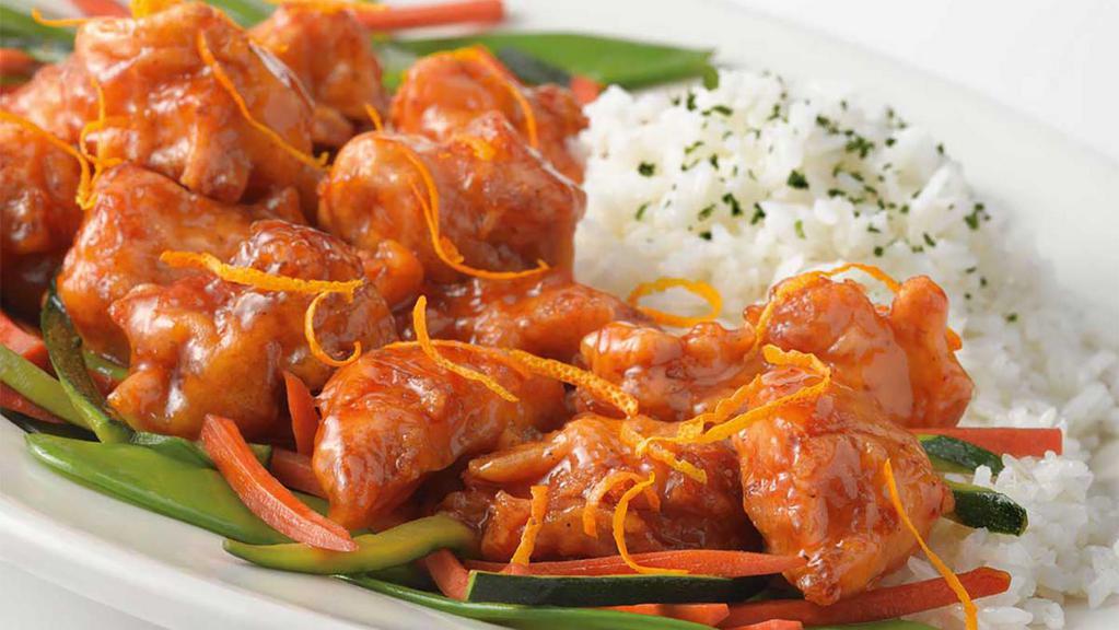 Orange Chicken · Deep Fried Pieces of Chicken Breast Covered in a Sweet and Spicy Orange Sauce. Served with White Rice and Vegetables.