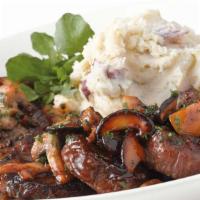 Steak Diane · Medallions of Steak Covered with Black Peppercorns and a Rich Mushroom Wine Sauce. Served wi...