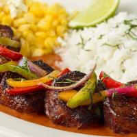 Carne Asada Steak Medallions · Steak Medallions Covered with Sauteed Peppers, Onions and Cilantro.  Served with Creamy Ranc...