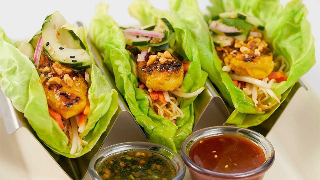 Asian Chicken Lettuce Wrap Tacos · Butter Lettuce Leaves Filled with Grilled Chicken and Carrots, Bean Sprouts, Cucumber, Cilantro and Rice Noodles with Spicy Peanut and Cashew Sauces