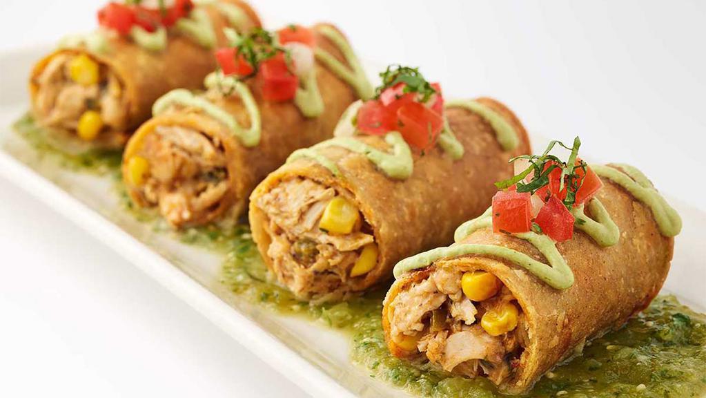 Chicken Taquitos · Crispy Corn Tortillas Filled with Grilled Chicken, Green Chile, Corn, Onion, Cilantro and Cheese. Served with Avocado Cream and Salsa Verde