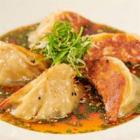 Chicken Pot Stickers · Asian Dumplings Pan-Fried in the Classic Tradition. Served with Our Soy-Ginger Sesame Sauce