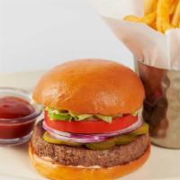 Impossible® Burger · A Delicious Plant-Based Burger with Lettuce, Tomato, Pickles, Onion and Mayonnaise on a Toas...