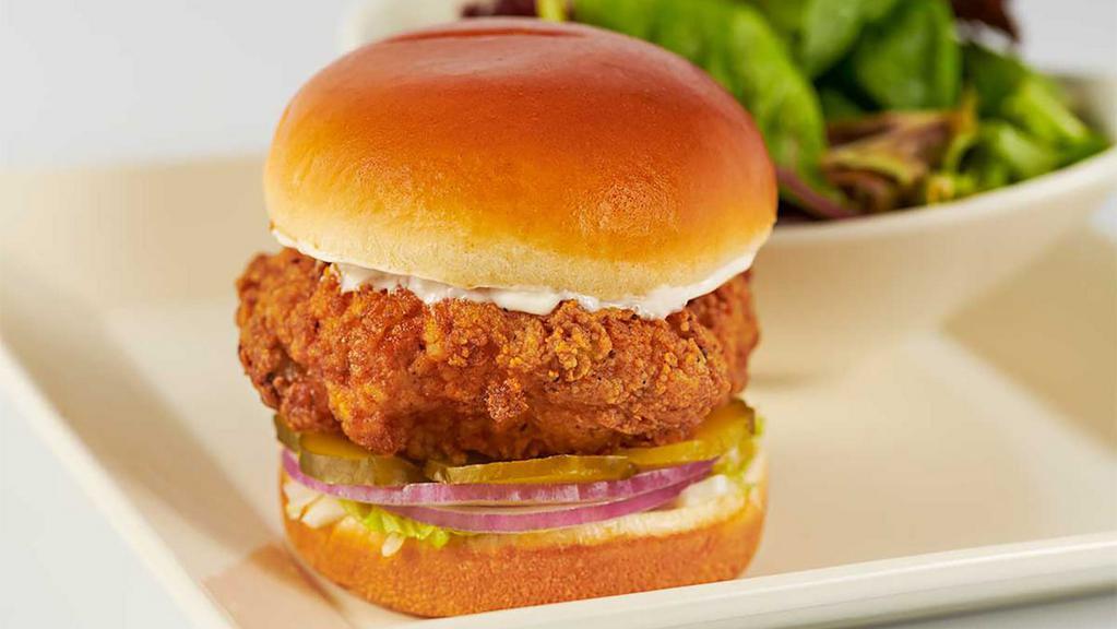 Skinnylicious® Crispy Chicken Sandwich With Ranch · Chicken Breast Fried Crisp with Lettuce, Pickles and Onions on a Toasted Bun. Served with a Green Salad