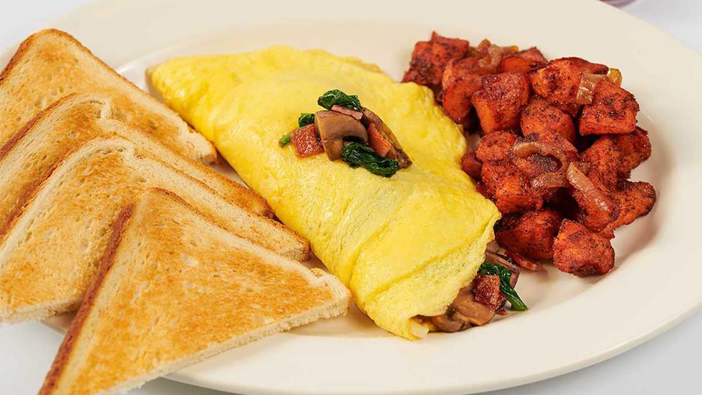 Spinach, Mushroom, Bacon And Cheese Omelette · Fresh Spinach, Sauteed Mushrooms, Smoked Bacon, Green Onions and Melted Cheese