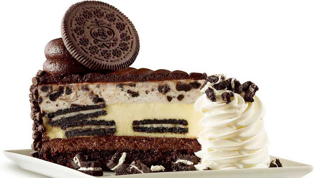 Oreo® Dream Extreme Cheesecake · Creamy Cheesecake Layered with Oreo® Cookies, Topped with Oreo® Cookie Mousse and Chocolate Icing