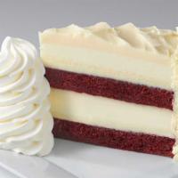 Ultimate Red Velvet Cake Cheesecake™ · Layers of Red Velvet Cake and Cheesecake Covered in Cream Cheese Frosting. Finished with Whi...