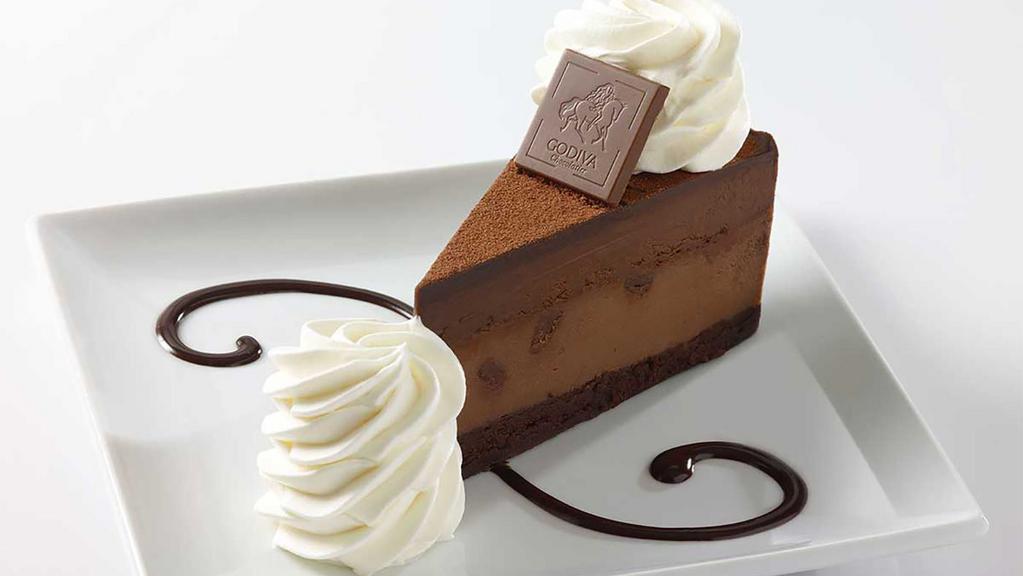 Godiva® Chocolate Cheesecake · Flourless Godiva® Chocolate Cake, Topped with Godiva® Chocolate Cheesecake and Chocolate Mousse
