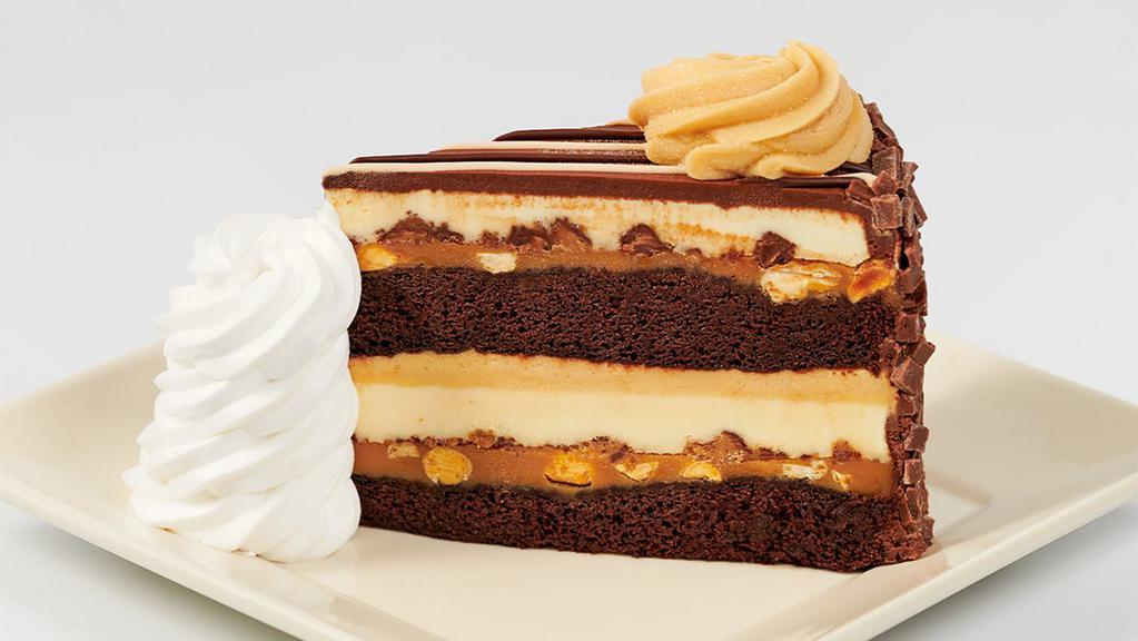 Reese'S® Peanut Butter Chocolate Cake Cheesecake · Reese's Peanut Butter Cups in Our Original Cheesecake with Layers of Delicious Fudge Cake and Caramel
