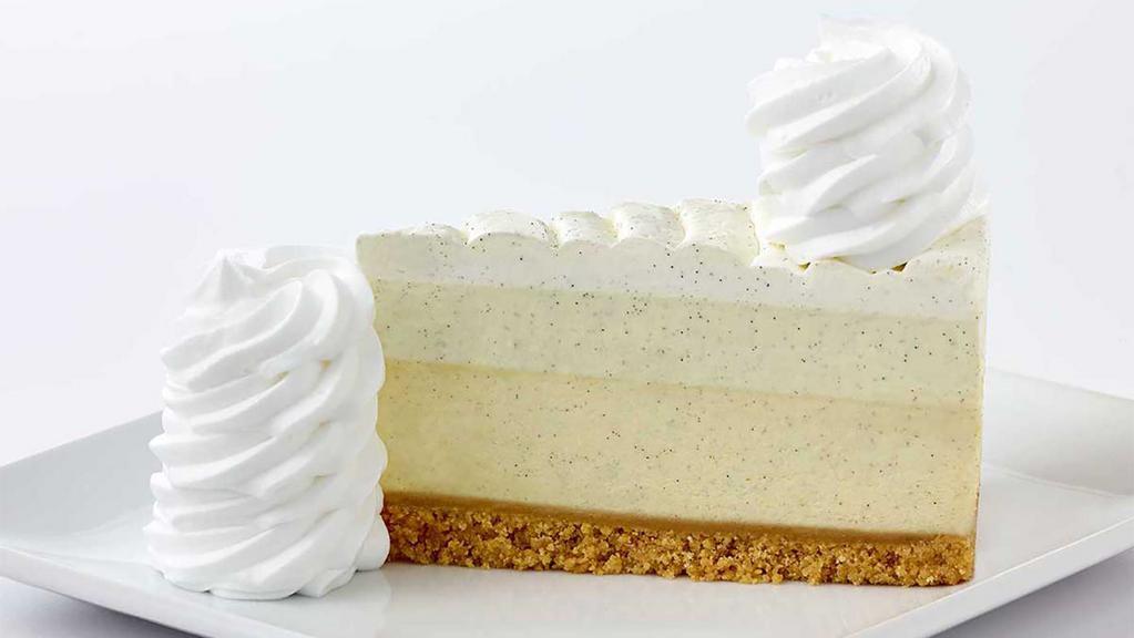 Vanilla Bean Cheesecake** · Creamy Vanilla Bean Cheesecake, Topped with Vanilla Mousse and Whipped Cream