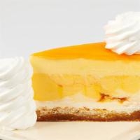 Mango Key Lime Cheesecake · Topped with Mango Mousse on a Vanilla Coconut Macaroon Crust