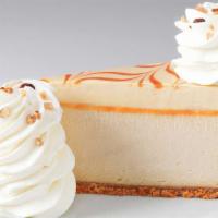 Dulce De Leche Caramel Cheesecake · Caramel Cheesecake Topped with Caramel Mousse and Almond Brickle on a Vanilla Crust
