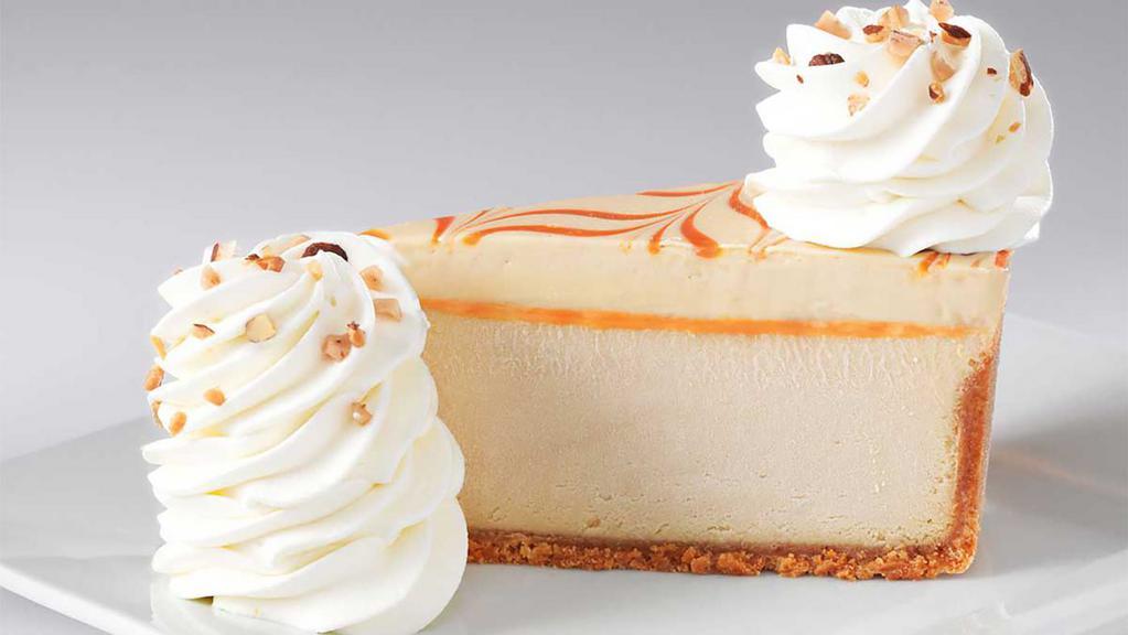 Dulce De Leche Caramel Cheesecake · Caramel Cheesecake Topped with Caramel Mousse and Almond Brickle on a Vanilla Crust