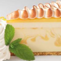 Lemon Meringue Cheesecake · Lemon Cream Cheesecake Topped with Layers of Lemon Mousse and Meringue