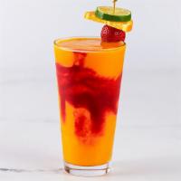 Frozen Iced Mango · Mango, Tropical Juices and a Hint of Coconut Blended with Ice and Swirled with Raspberry Puree