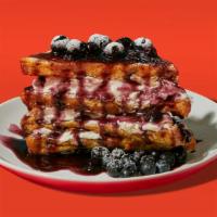 Blueberry Stuffed French Toast · Four half slices of egg-washed french toast stuffed with cream cheese and blueberries and to...