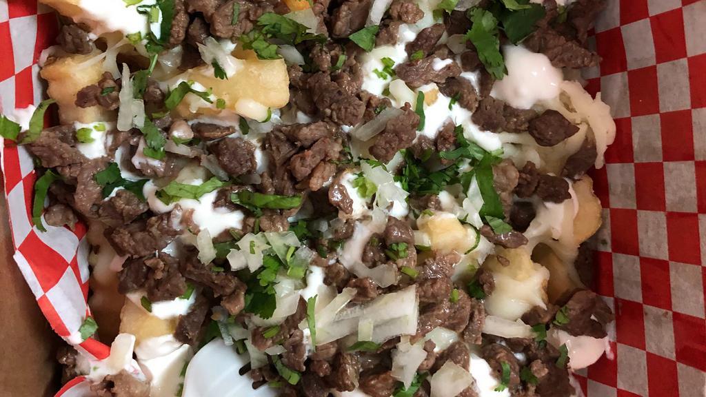Steak cheese fries · Choice of meat,cheee,sour cream,cilantro,onion,hotsauce