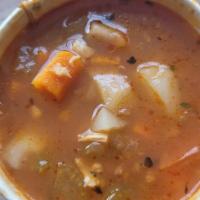 Scott's Manhattan Style Clam Chowder · Loaded with clams, tomato-based broth, red potatoes, onions, and celery.