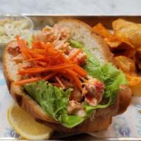 Scott's Maine Style Lobster Roll · Served  Cold. Fresh Lobster Tossed with our Special House dressing and Seasonings. Topped wi...
