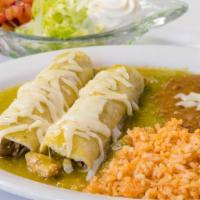 Enchiladas · Two red or green enchiladas with choice of chicken or ground beef, served with rice, refried...