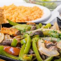 Fajitas (Steak or Chicken Mix or Shrimp) · Charbroiled steak or chicken, served on a sizzling plate with rice, refried beans and tortil...