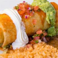 Chimichanga · A deep-fried tortilla filled with chicken or steak topped with ranchera sauce, sour cream, p...
