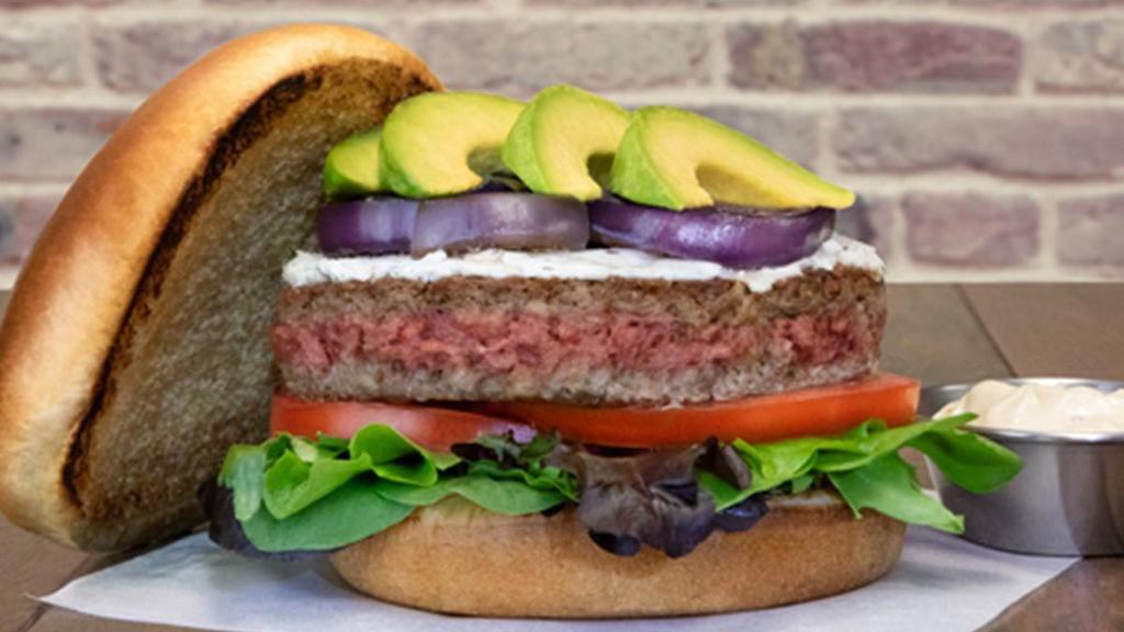 Impossible™ Burger · Impossible™ Burger • herbed goat cheese • organic mixed greens • tomatoes • grilled red onions • avocado • garlic aioli • brioche bun