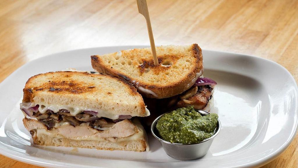 The Meltdown · grilled chicken breast • provolone • sautéed mushrooms • grilled red onions • basil pesto or housemade thousand island • griddled sourdough