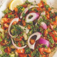 City Salad · Tomatoes, cucumbers, onions, parsley, lemon, olive oil and sumac.