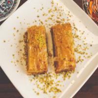 Baklava · Sweet dessert pastry made of layers of filo dough, filled with chopped walnuts, sweetened an...