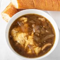 Soupe a L’oignon · Most popular. French onion soup served with crouton smothered with gruyere cheese.