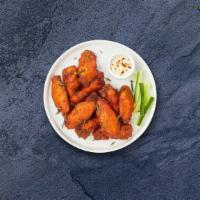 Chicken Wings · Fresh chicken wings breaded, fried until golden brown, and tossed in hot sauce. Served with ...