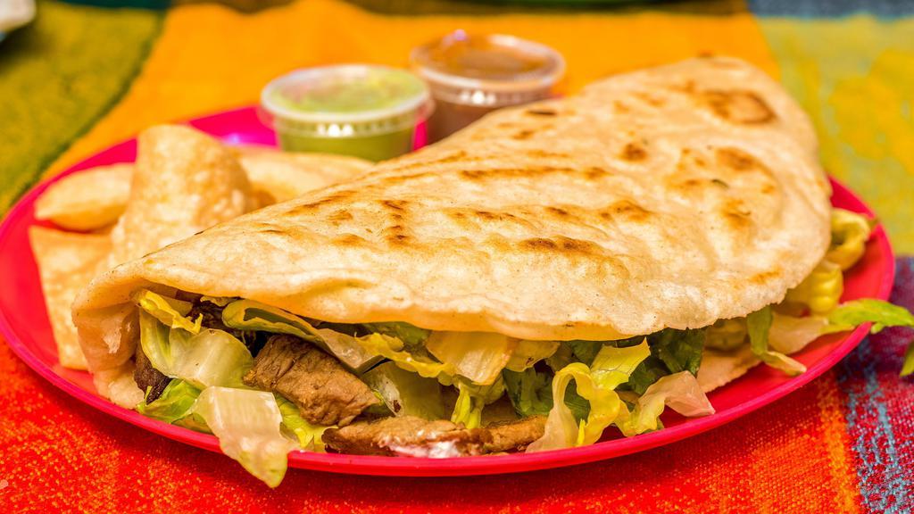 Corn Quesadilla · Hand made corn tortilla, Cheese, Choice of Meat, Sour Cream and Lettuce