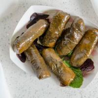 Dolemeh · Marinated grape leaves stuffed with rice.