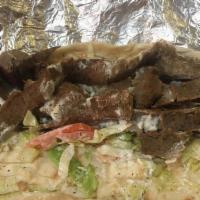Lamb Gyro (Wrap) · Served with grilled onions, lettuce, tomato, tzatziki sauce, and wrapped in pita bread