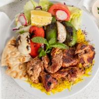 Chicken Breast Tikka · Served with Basmati rice, salad, Naan Bread, and chutney