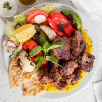 Lamb Tikka · Served with Basmati rice, salad, Naan Bread, and chutney