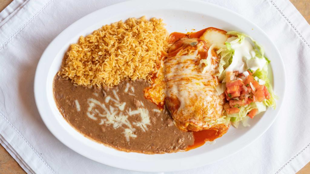 Chile Relleno · Served with meat rice beans guacamole salsa sour cream lettuce and tortillas.