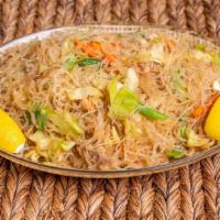 Pancit Bihon · Sautéed rice noodles with chicken and vegetables.