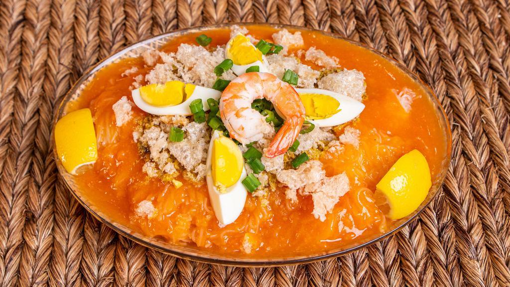 Pancit Palabok · Rice noodles topped with special sauce, shrimp, eggs, and chicken.