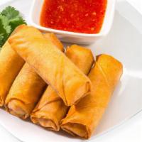 Spring rolls (4 pieces) · 4 pieces of vegetable spring rolls.  Floor stuffed with cabbage, carrots and onions.