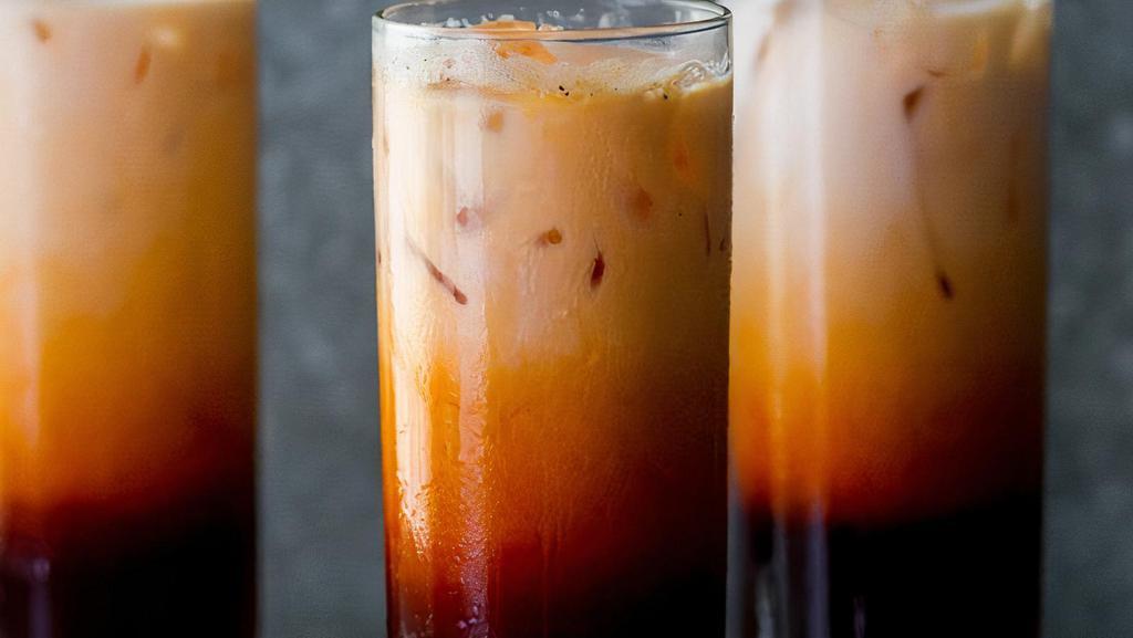 Thai Tea · Thai tea with boba and non-dairy cream. Boba can be replaced with other toppings.
