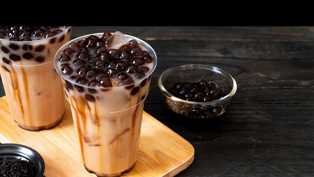 Milk Tea · Milk tea with boba and non-dairy cream. Boba can be replaced with other toppings.