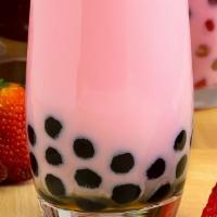 Strawberry tea · Strawberry milk tea with boba and non-dairy cream.