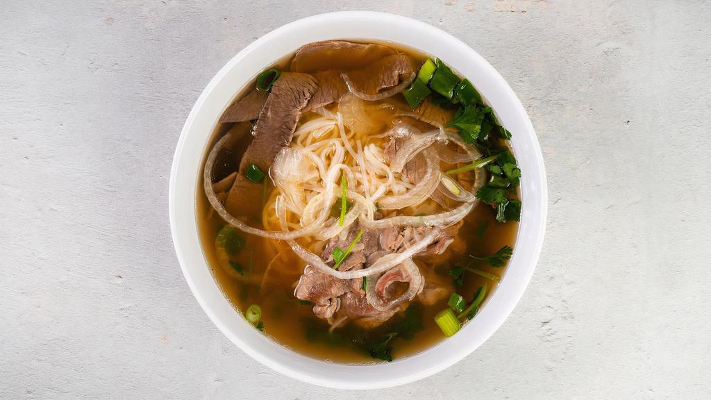 Pho Tai & Chin Nam · Rice noodles, signature beef broth with thinly sliced steak and brisket. Gluten-Free. Conatins fish. We cannot make substitutions.