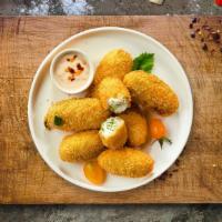 The Bomb · Fresh jalapenos coated in cream cheese and fried until golden brown.