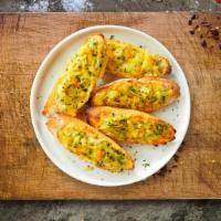 Chizin' Garlic Manic · Toasted bread, butter, garlic, mozzarella cheese, and parsley.