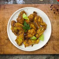 Sour Pepper Wings  · Fresh chicken wings breaded, fried until golden brown, and tossed in lemon pepper sauce. Ser...