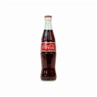 Mexican Coke Bottle · Mexican coke made with pure cane sugar.