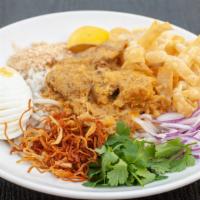 Nan Gyi Thoke · Rice noodle with coconut chicken curry sauce, hard boiled egg, pea powder, fresh and fried r...
